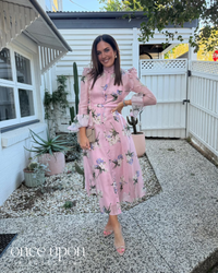 Leo Lin Katrina Butterfly Sleeve Midi Dress in Bouquet Pastel Pink print, lifestyle view outdoors, alternate pose