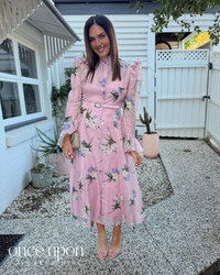 Leo Lin Katrina Butterfly Sleeve Midi Dress in Bouquet Pastel Pink print, lifestyle view outdoors