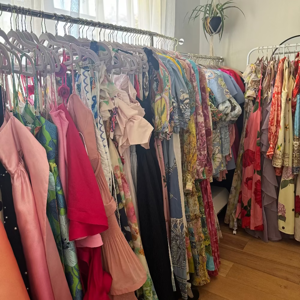 Racks of designer hire dresses in the Once Upon a Dress Hire home studio, Mount Gravatt East, Brisbane