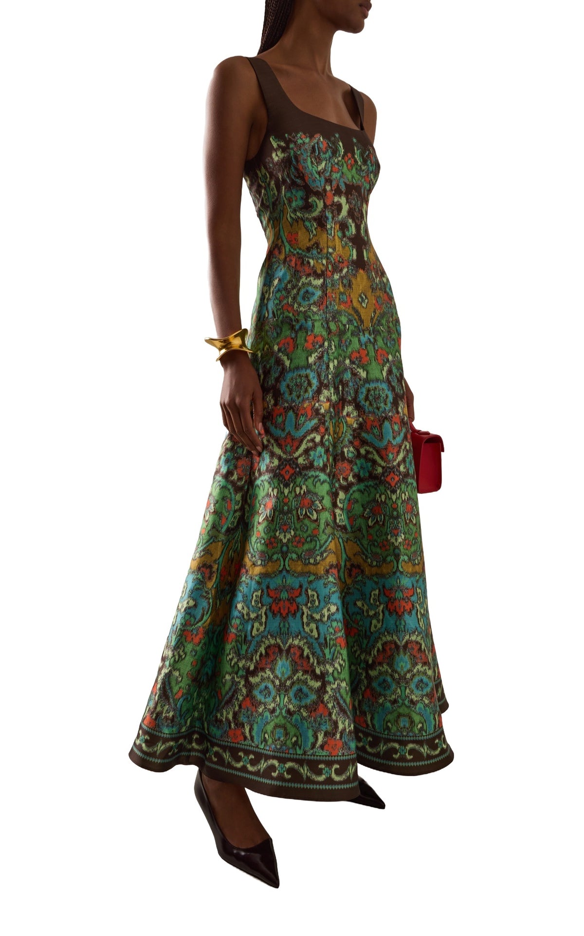Alemais Charlotte Gown in green watercolour print, front view with red clutch
