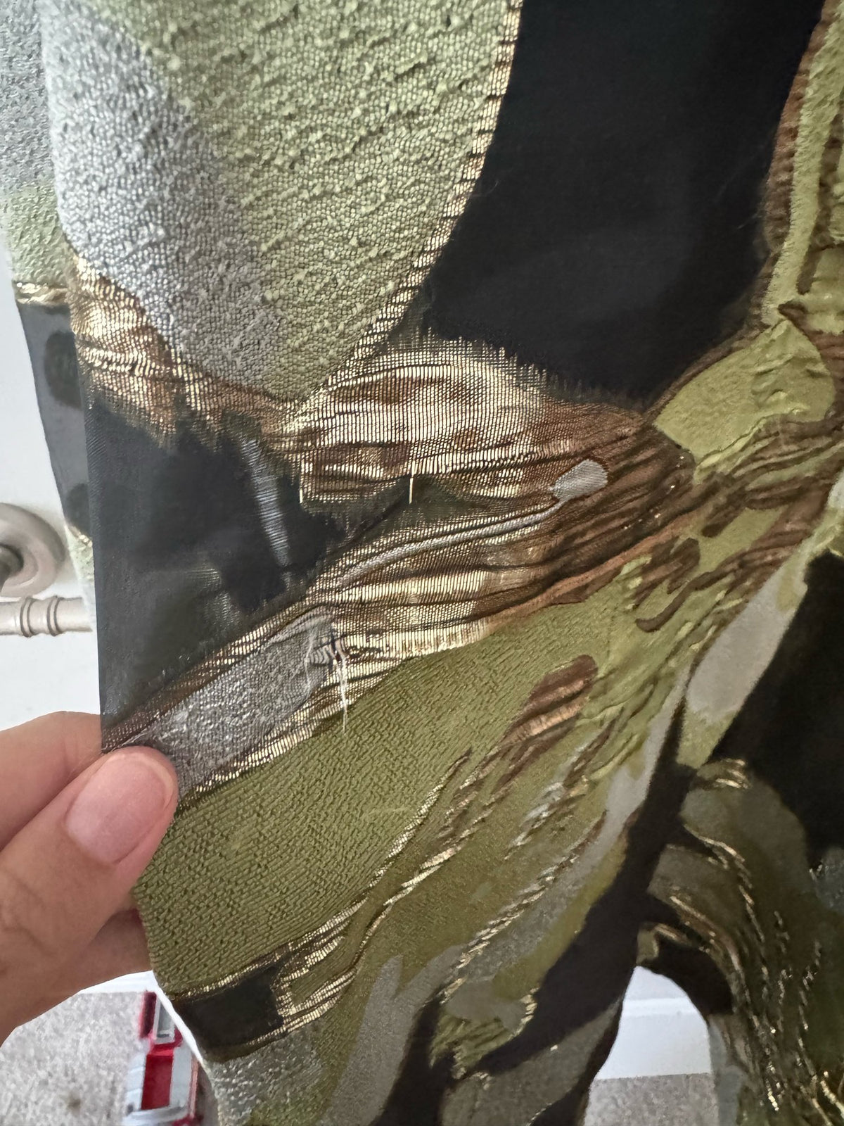 Elliatt Elysia gown size L condition photo showing pulls and loose metallic thread