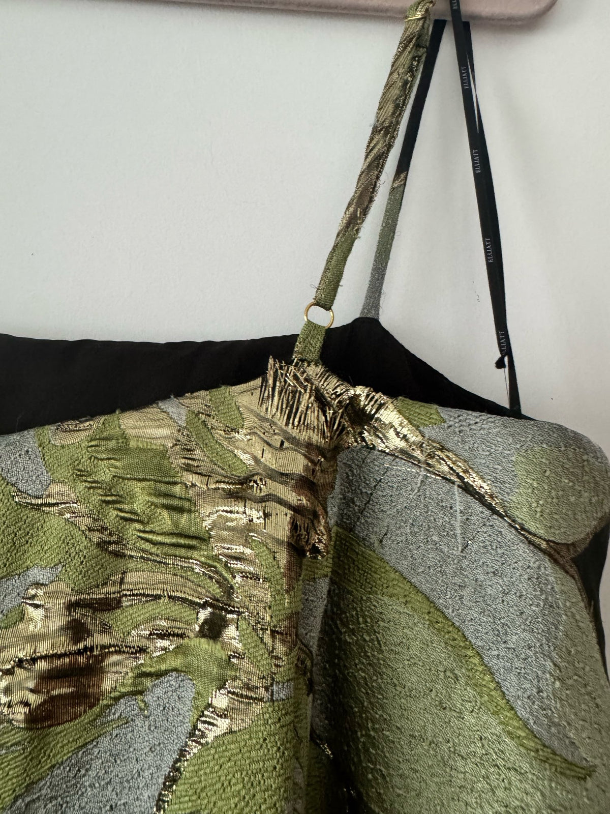 Elliatt Elysia gown size L condition photo showing pulls and loose metallic thread