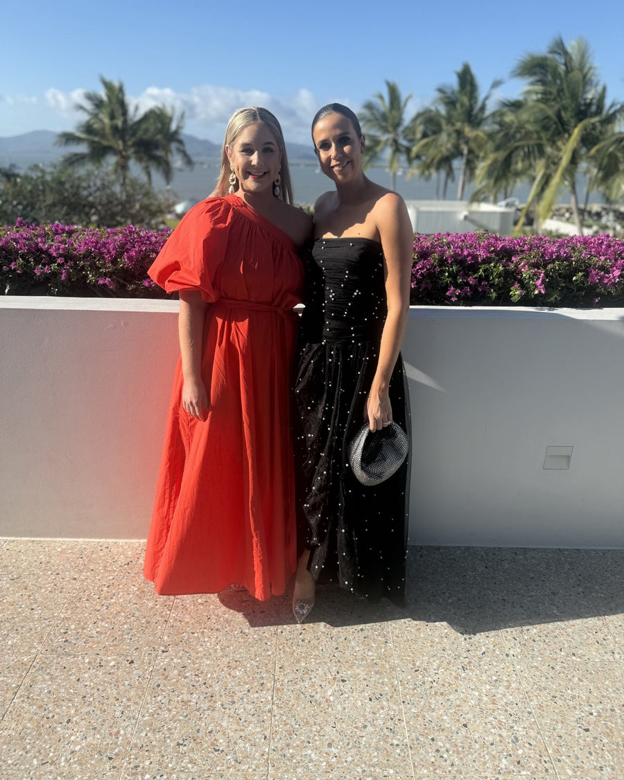 Lori and Molly in Oroton red one-shoulder and Aje Juniper pearl gown