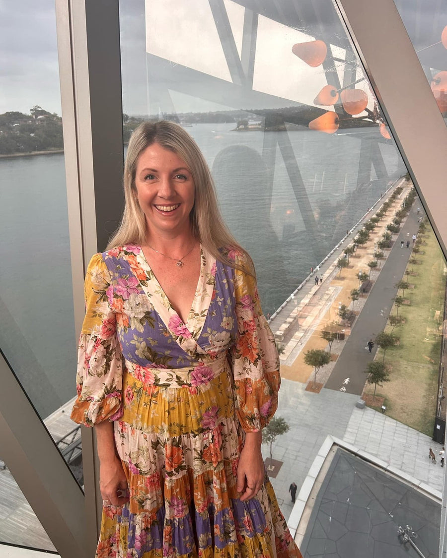 Customer in Zimmermann Halliday Tiered Wrap Midi Dress